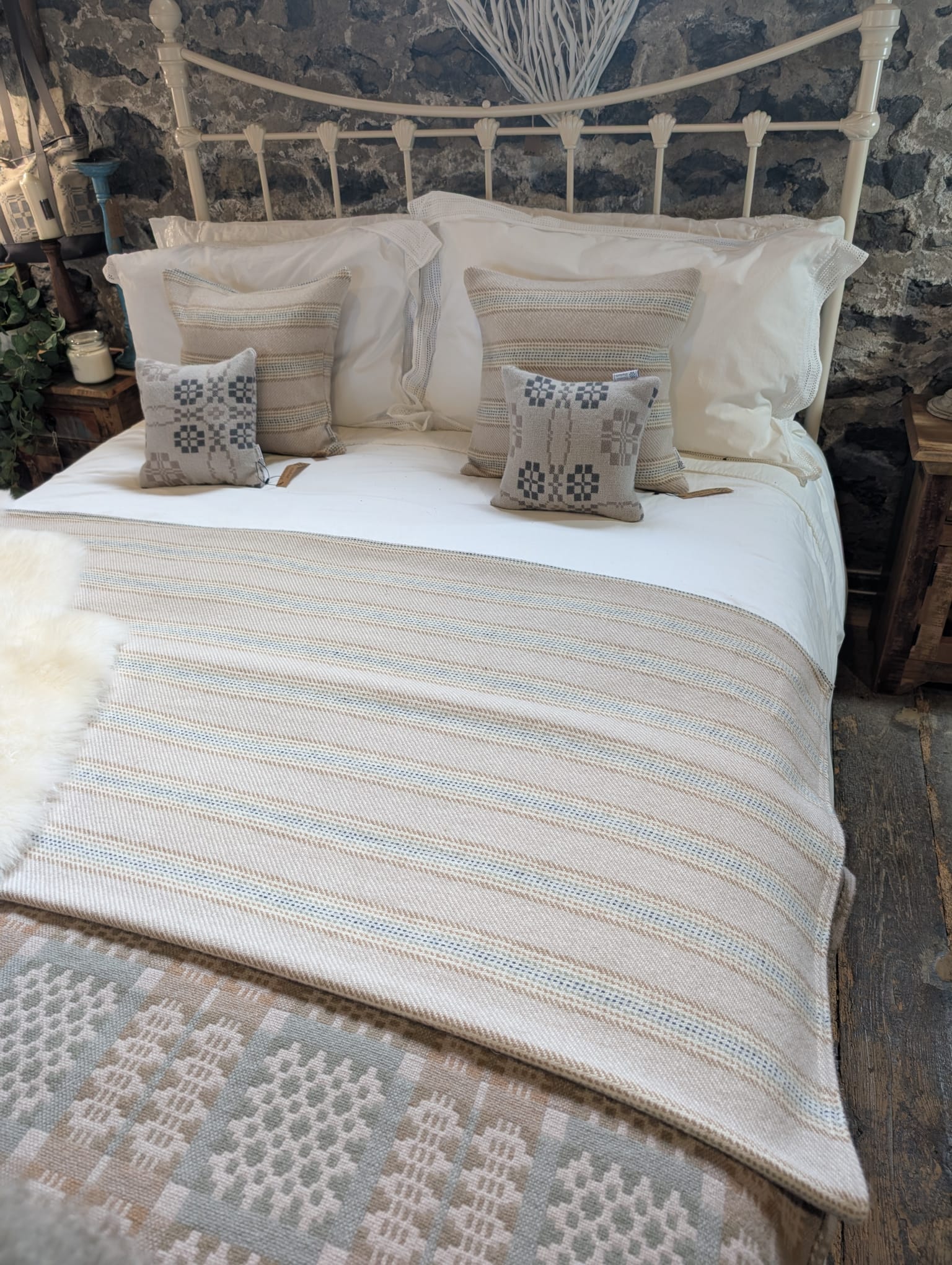 Traditional wool blanket styled on a bed by Dinefwr Blankets
